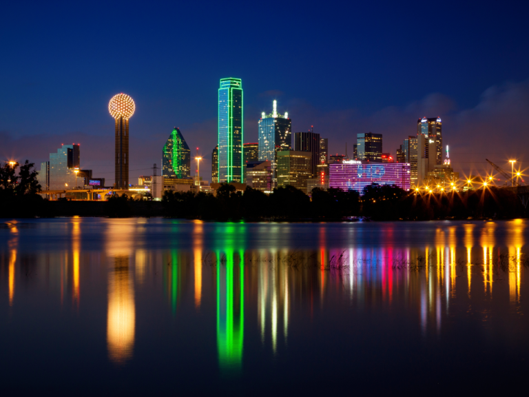 nighttime photo of dallas skyline with buildings all lit up - Things to know before moving to dallas texas